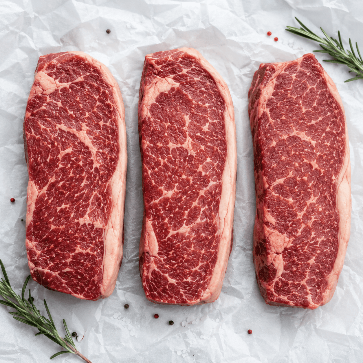 Marbled fresh beef steaks trimmed and ready for distribution